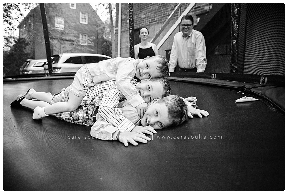 Brother sandwich on the trampoline in Brookline, MA