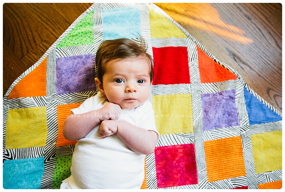 bright colorful quilt made by grandma for the newest baby girl in the family