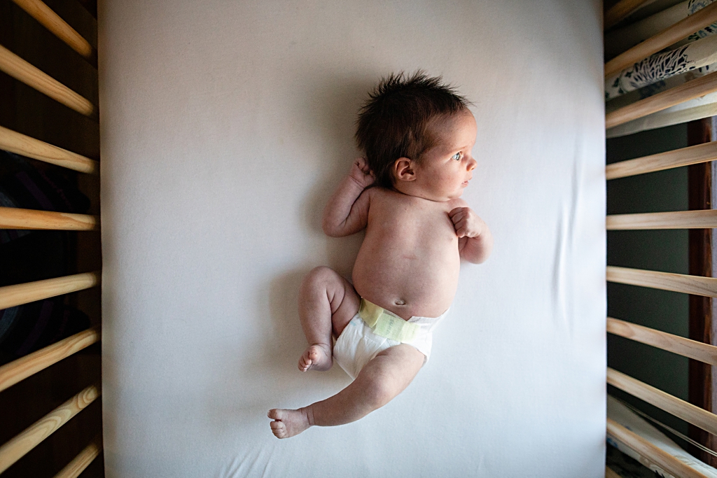 Newborn photo in crib Boston