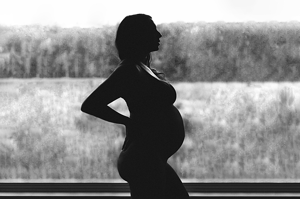 Unique dramatic black and white maternity portrait