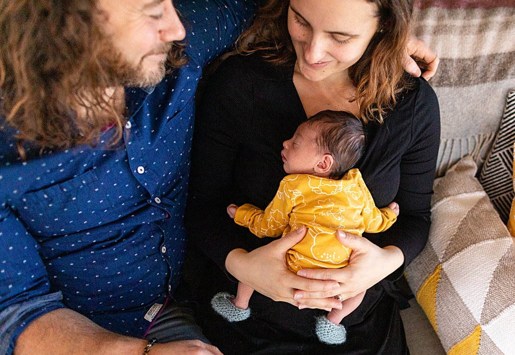 Parents holding newborn baby boy in boston, ma