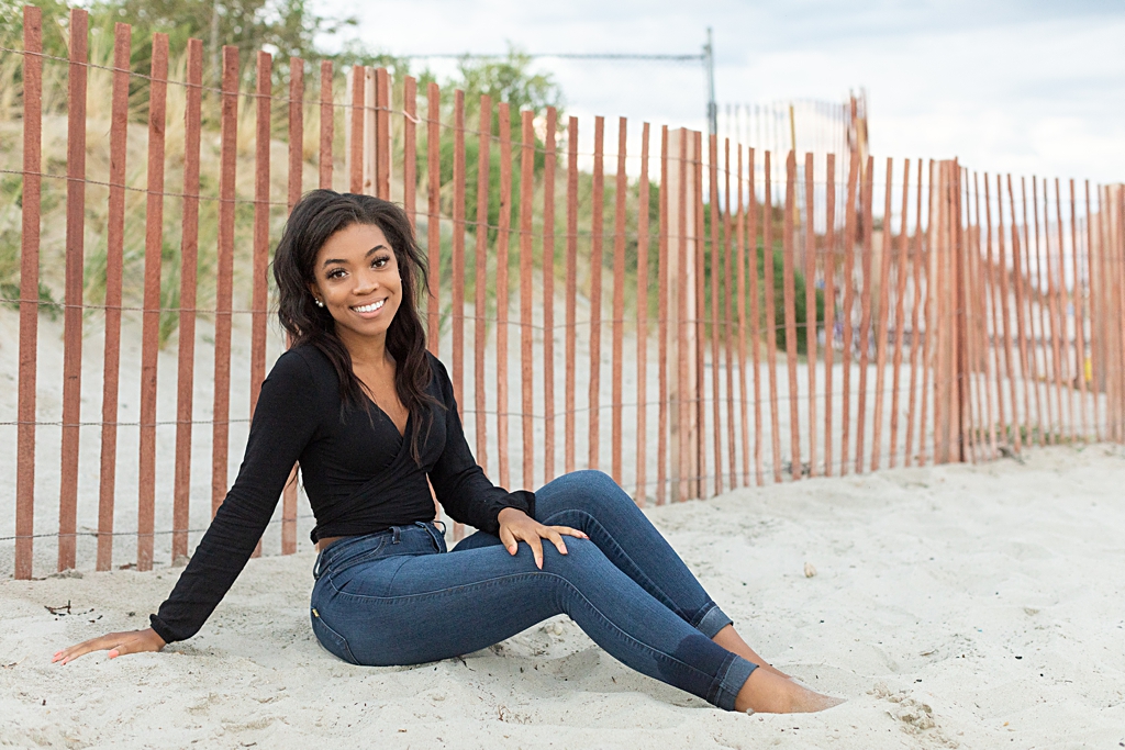 high school student in senior photo session on the beach