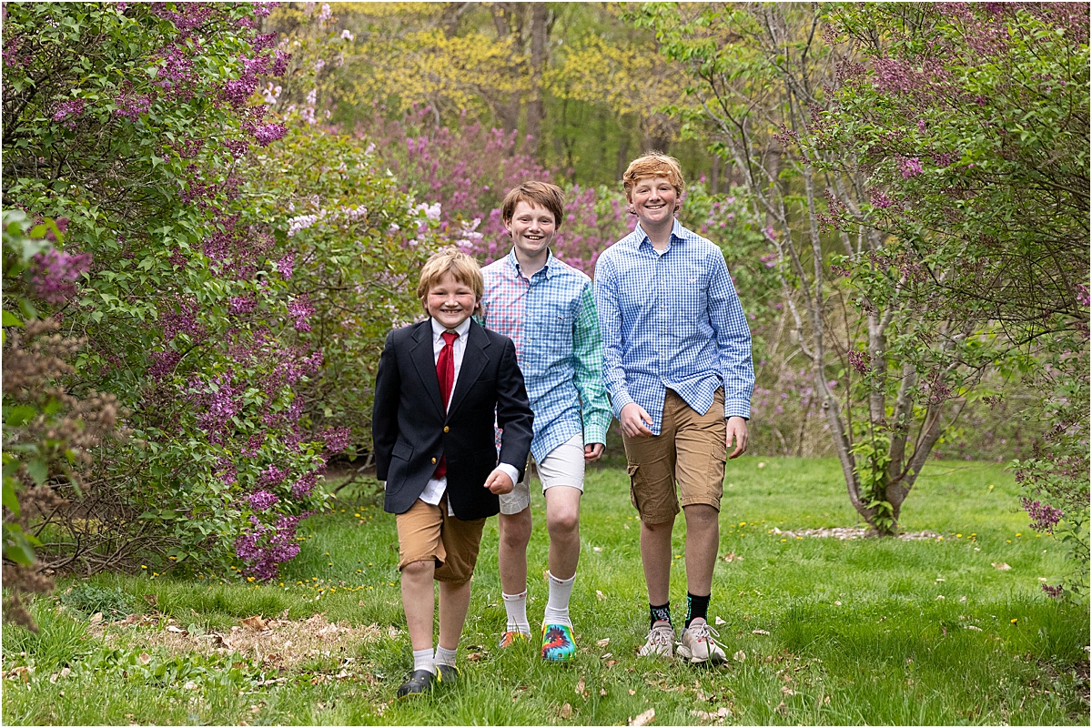 three boys during boston spring lilacs
